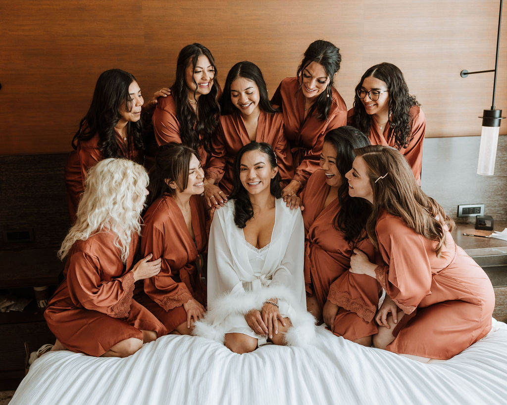 bride gets ready with bridesmaids in wedding hotel