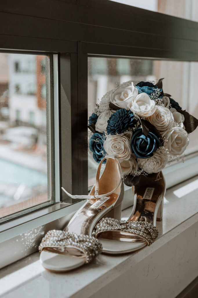 wedding shoes next to wedding bouquet 