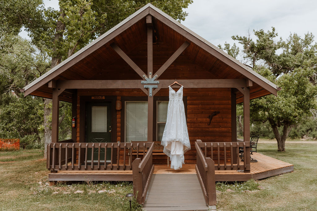 wedding dress hangs on cabin at Castle Valley Inn 