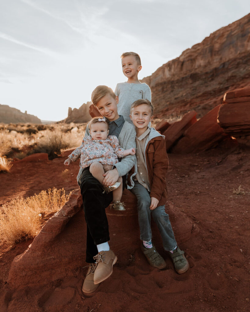 kids pose with newborn at Moab family photo session