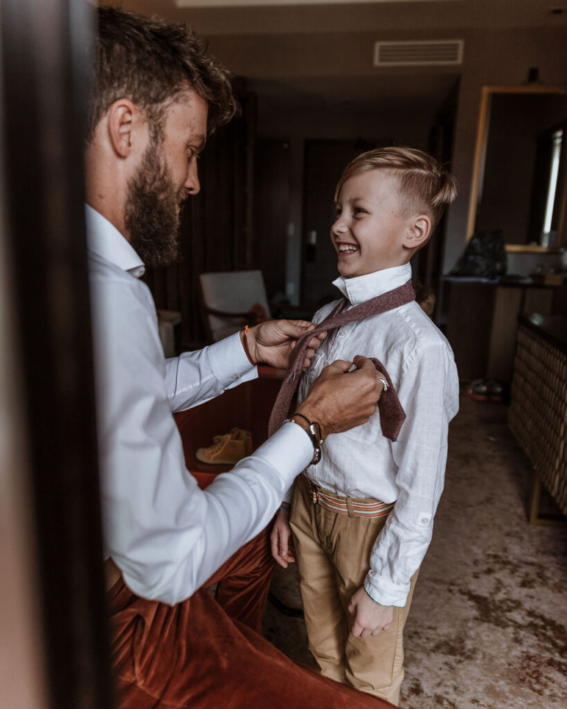 groom gets ready with sons captured by Moab wedding photographer 