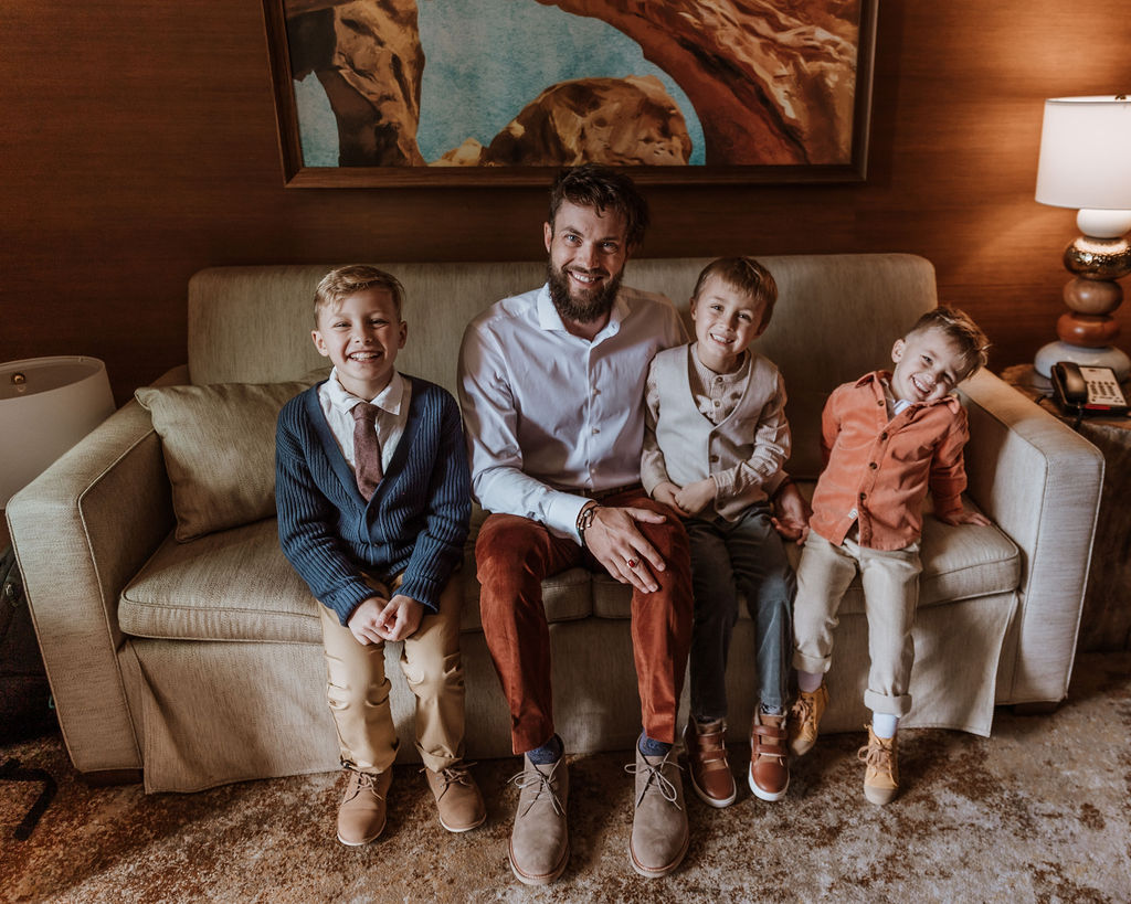 groom gets ready with sons captured by Moab wedding photographer 