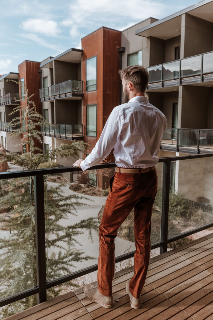 groom gets ready at a top where to stay in Moab location