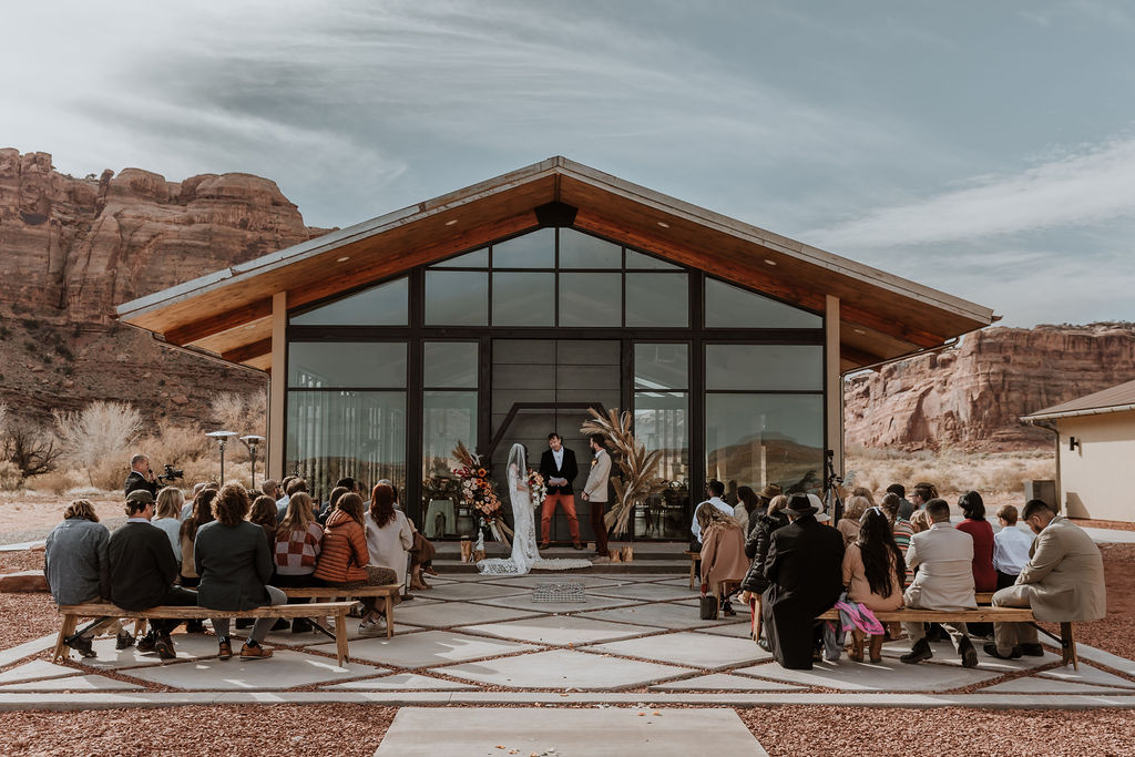 couple exchanges vows during The Red Earth venue Moab wedding ceremony