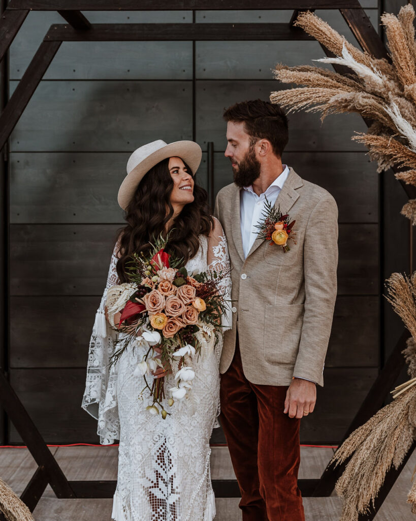 couple embraces at The Red Earth Venue Moab wedding