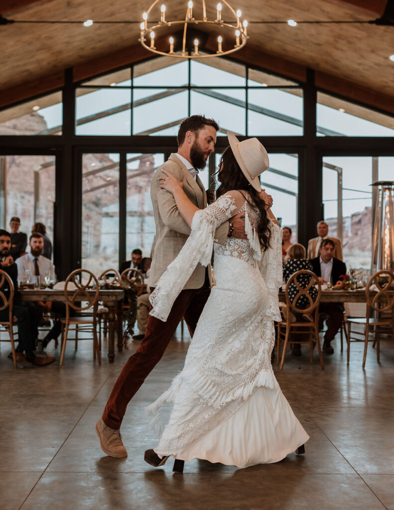 couple dances together at The Red Earth Venue Moab wedding