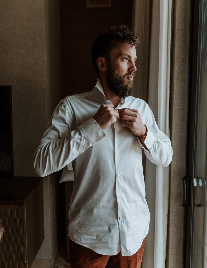 groom gets ready on wedding day captured by Moab wedding photographer 