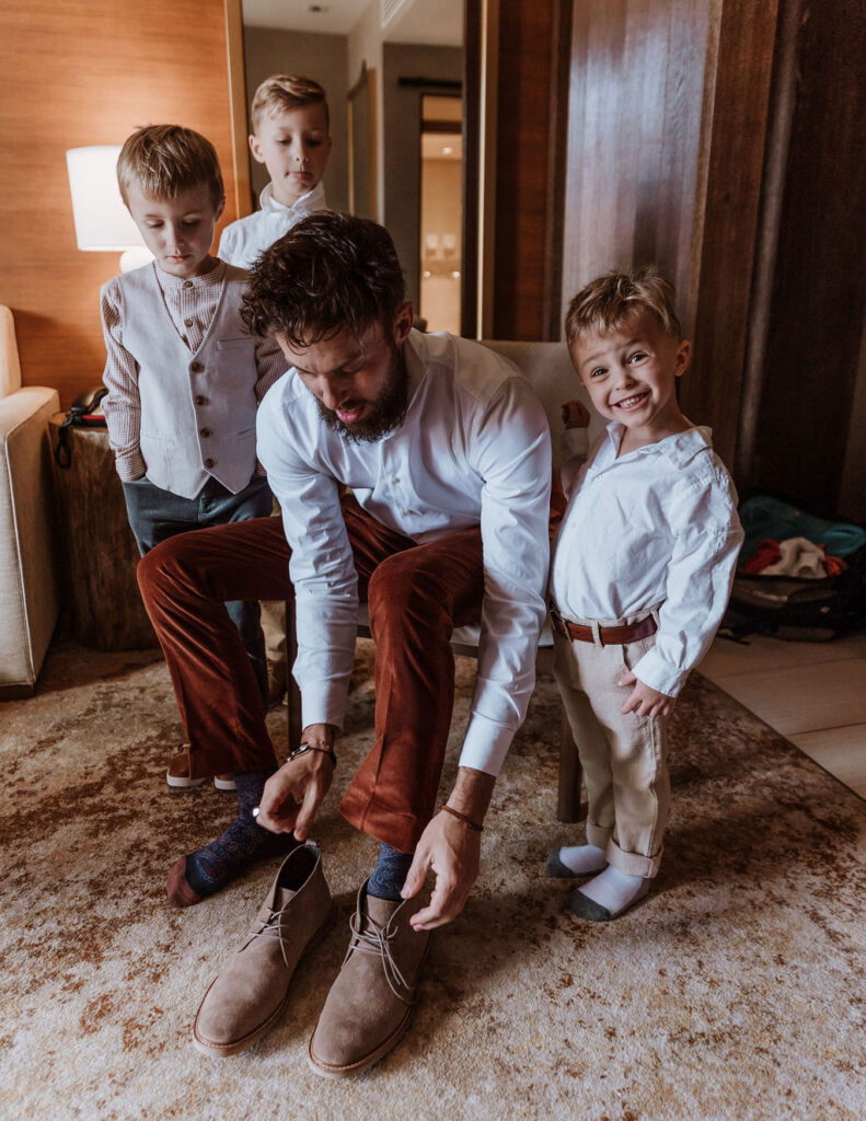 groom gets ready with sons captured by Moab wedding photographer 