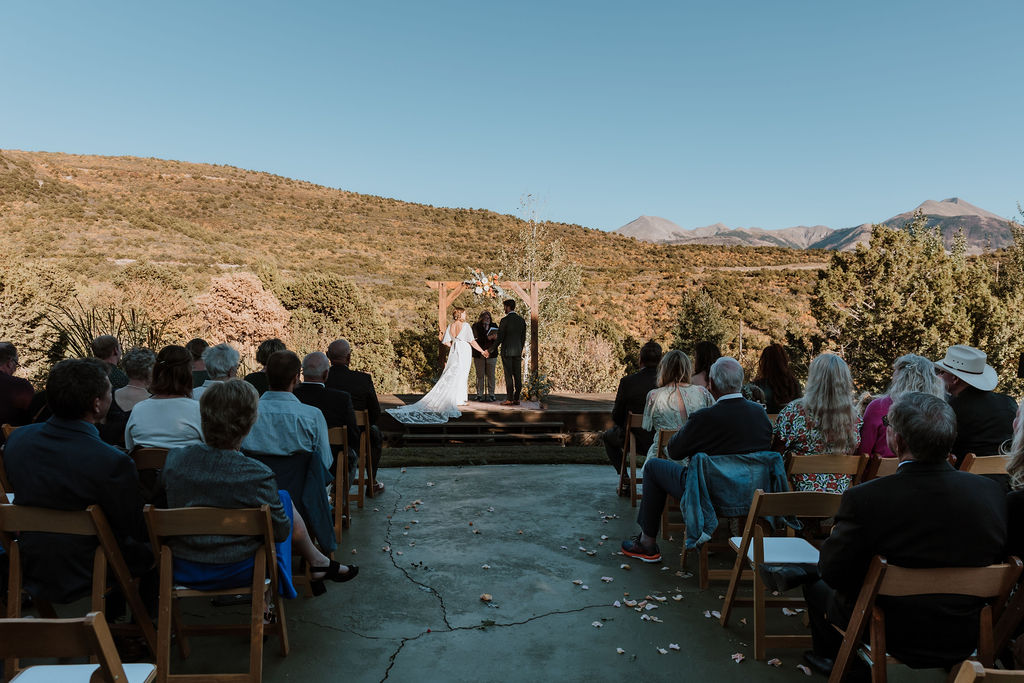 couple exchanges vows at Whispering Oaks Ranch wedding