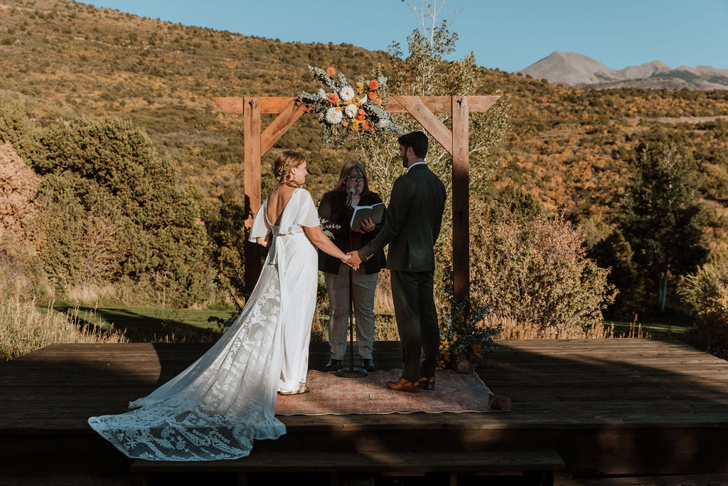 couple exchanges vows at Whispering Oaks Ranch wedding ceremony 