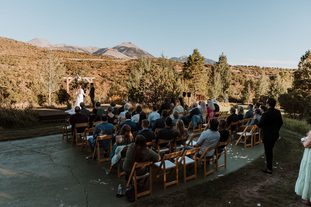 couple exchanges vows at Whispering Oaks Ranch wedding