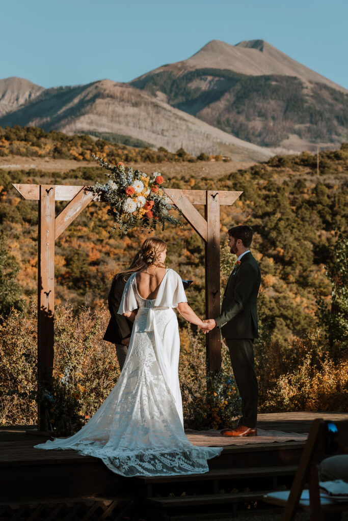 couple exchanges vows at Whispering Oaks Ranch sunset ceremony