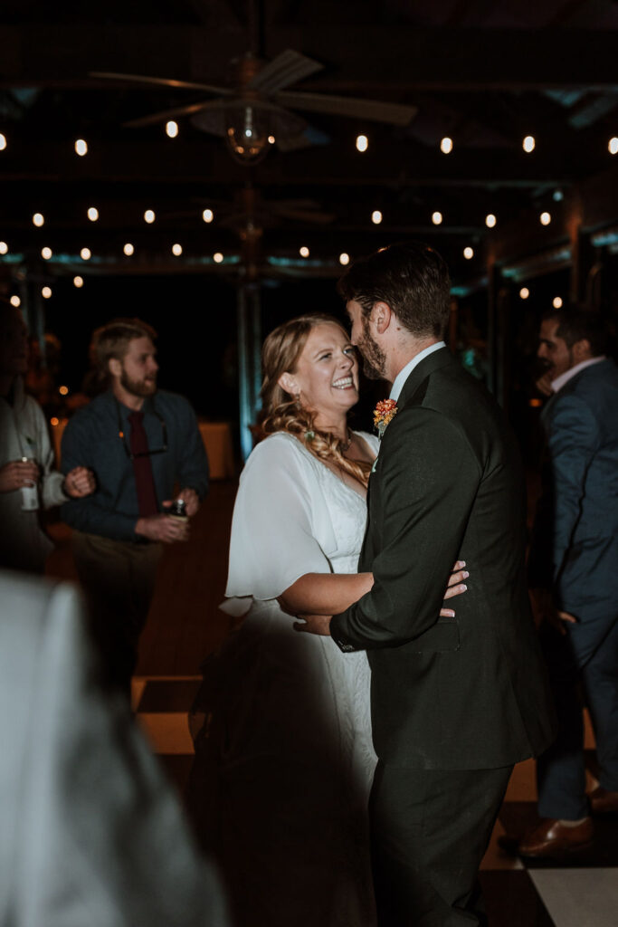 couple dances together during wedding reception