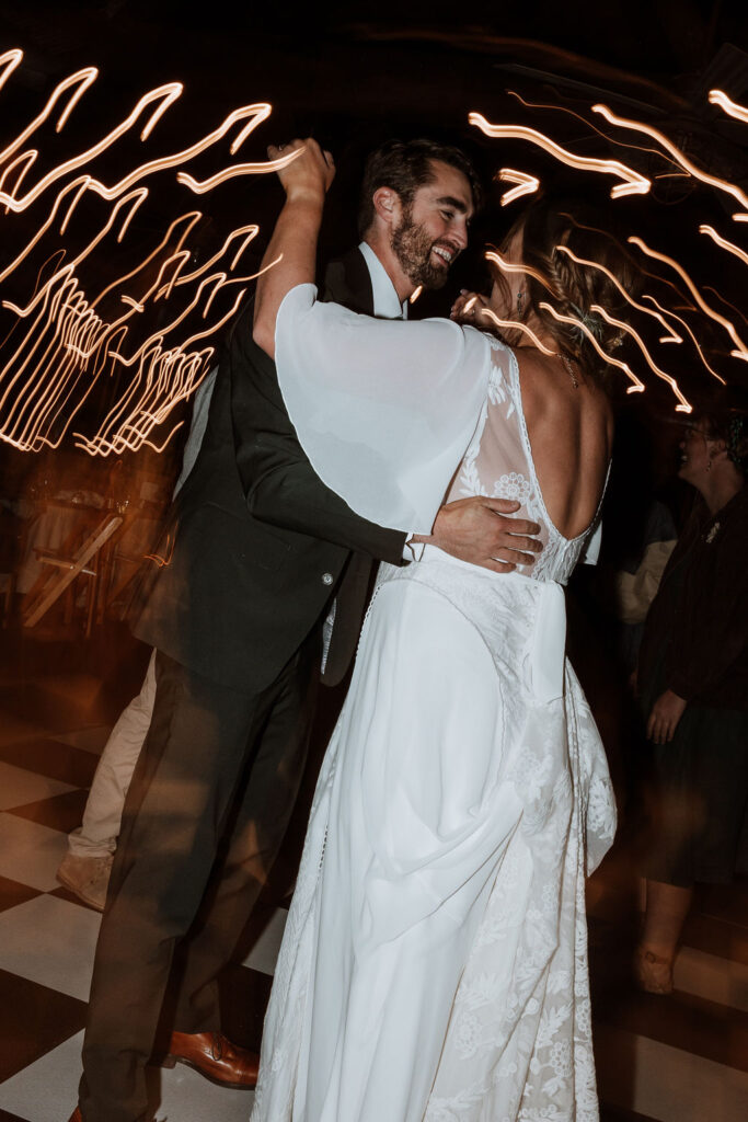 couple dances together during wedding reception