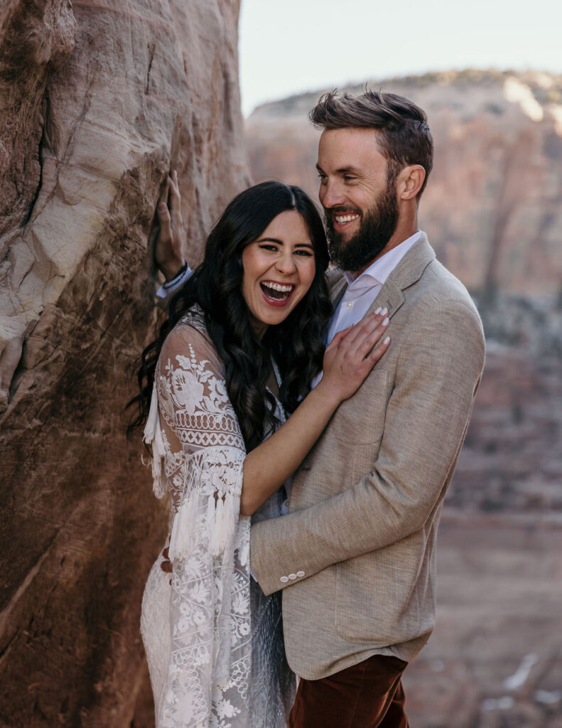 couple laughs together at Canyonlands elopement