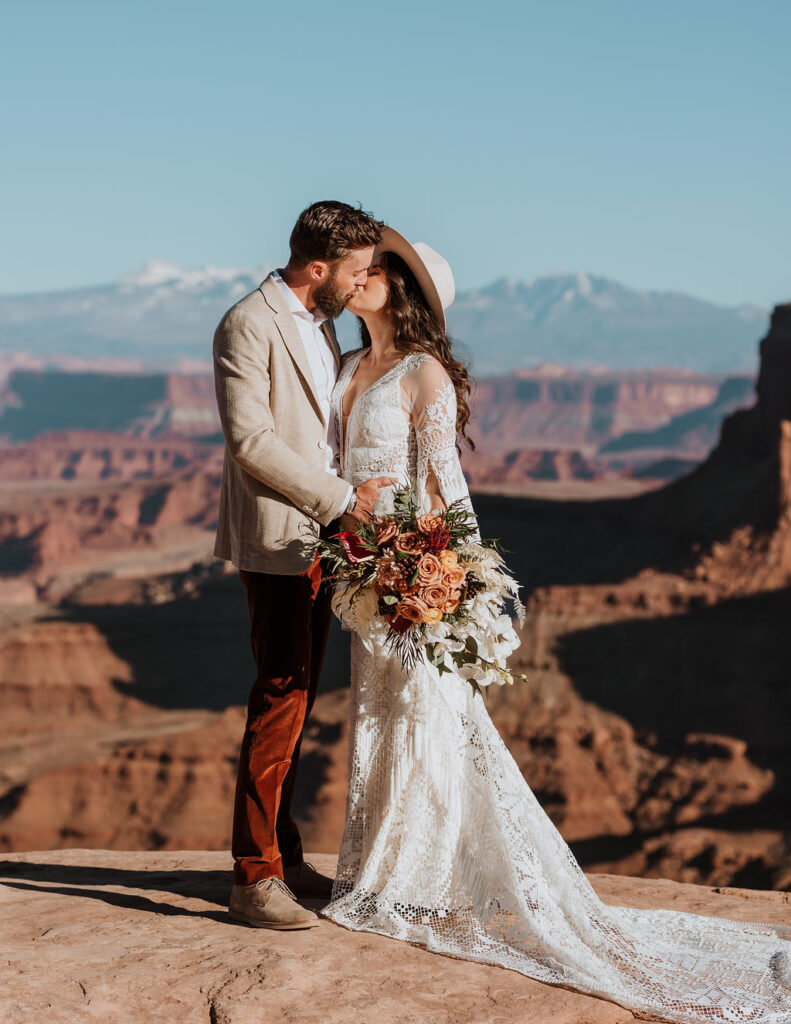 couple kisses at Canyonlands elopement