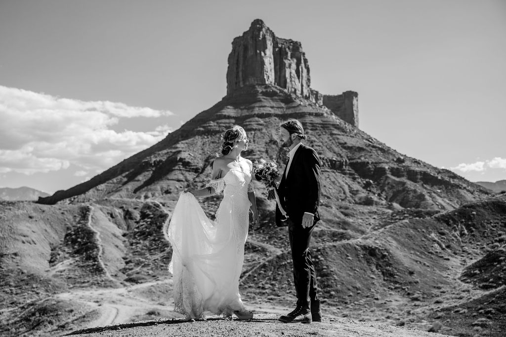 couple stands together at Moab elopement