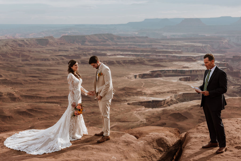 couple exchanges vows on overlook at Canyonlands elopement