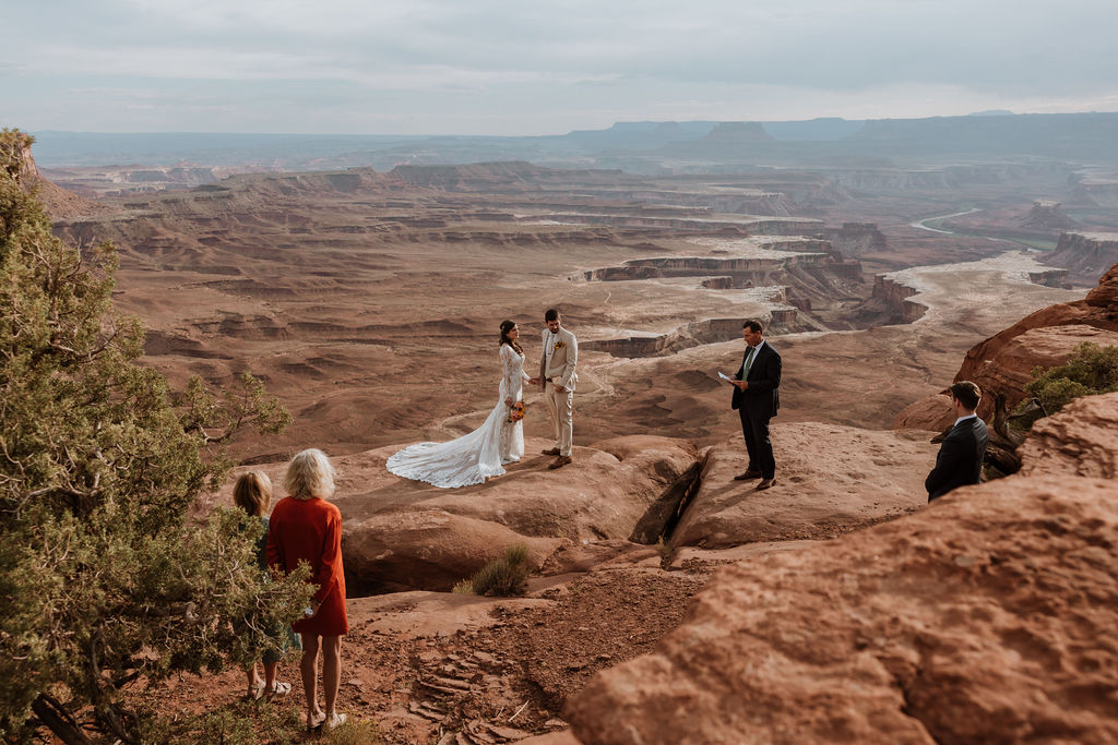 couple exchanges vows on overlook at Canyonlands elopement