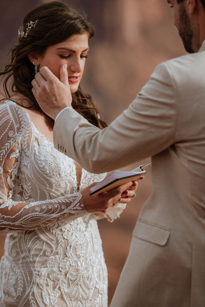 couple exchanges vows on overlook at Canyonlands elopement