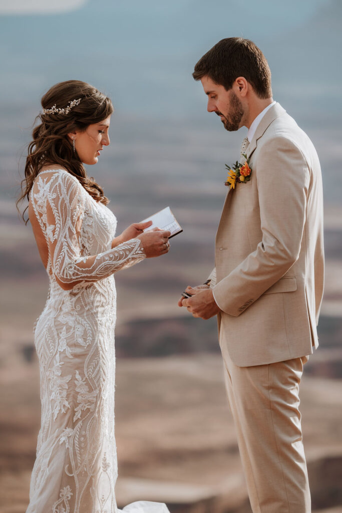 couple exchanges vows on overlook at Canyonlands elopement