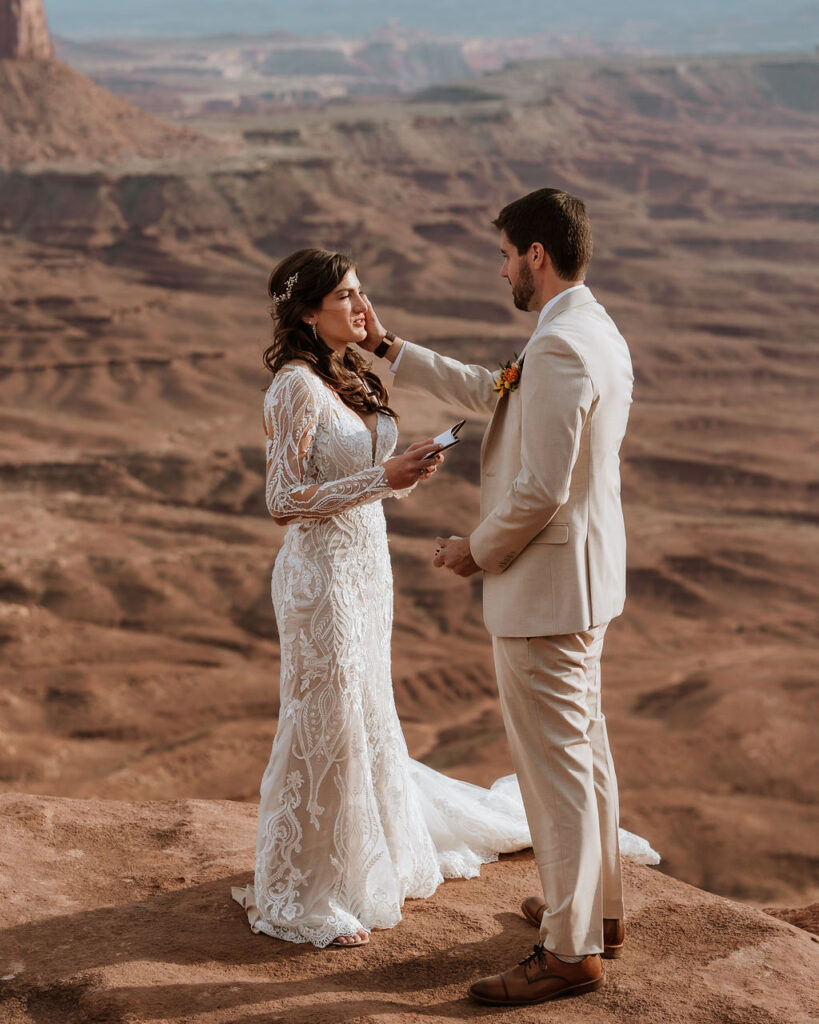 couple exchanges vows on overlook at Canyonlands elopement