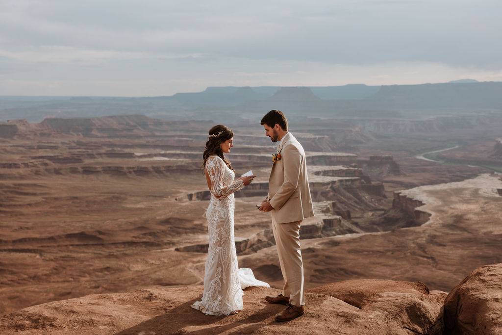 couple exchanges vows on overlook at Canyonlands elopement