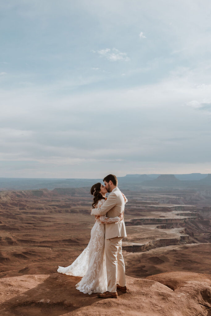 couple kisses at Canyonlands National Park elopement