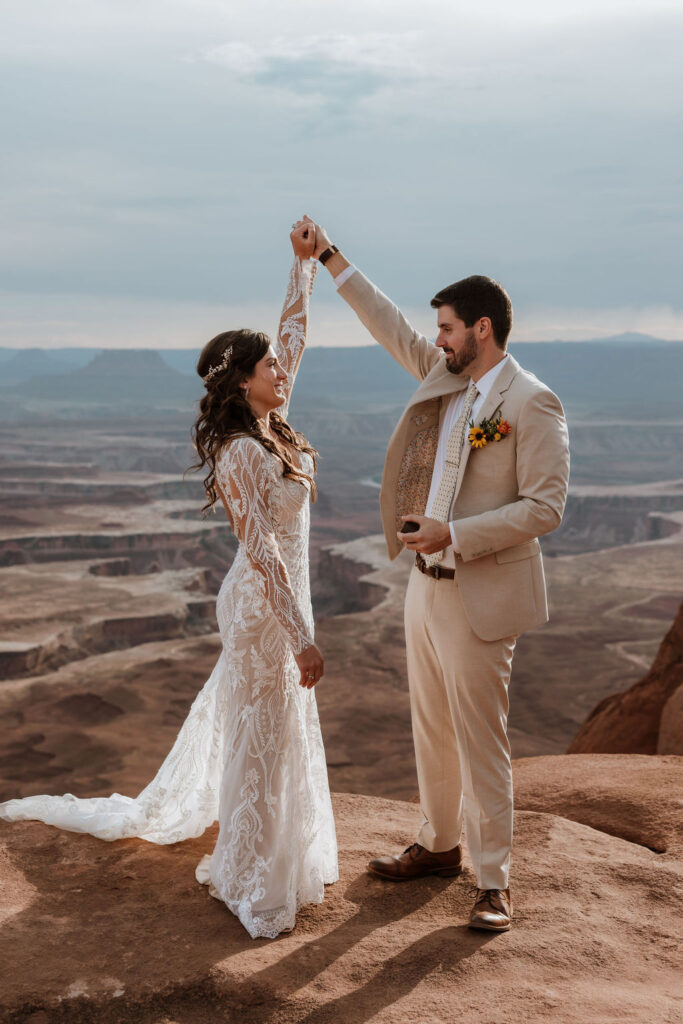 couple twirls at Canyonlands National Park elopement