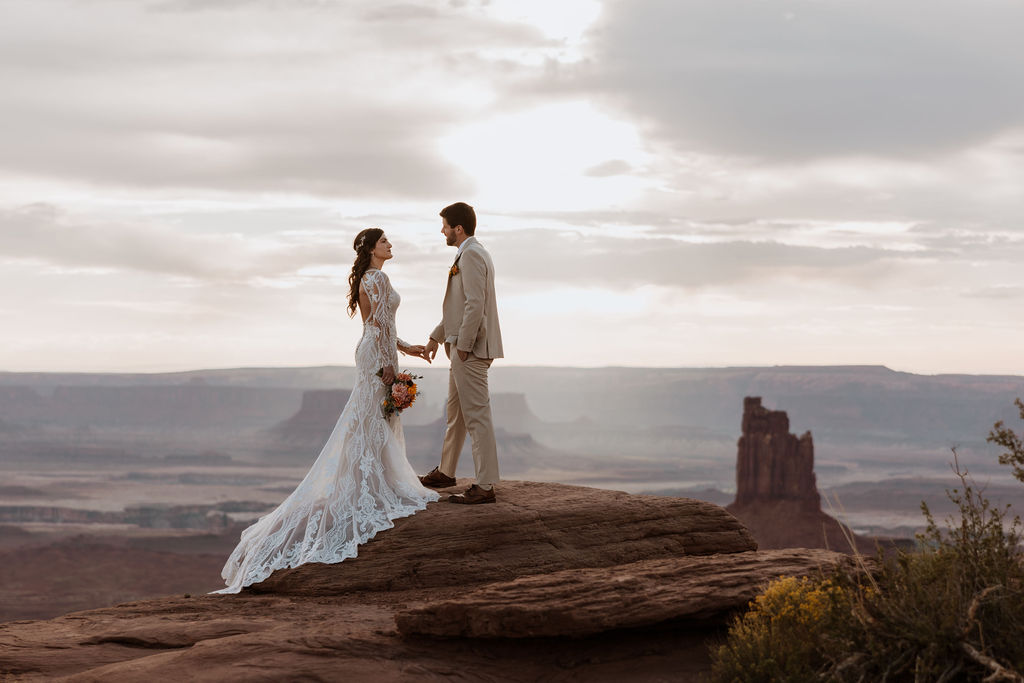 couple holds hands at Canyonlands National Park elopement