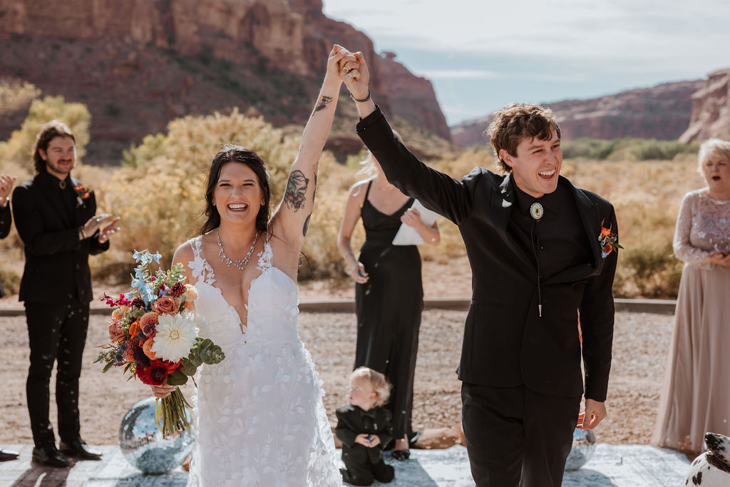 couple holds hands at The Red Earth Venue wedding