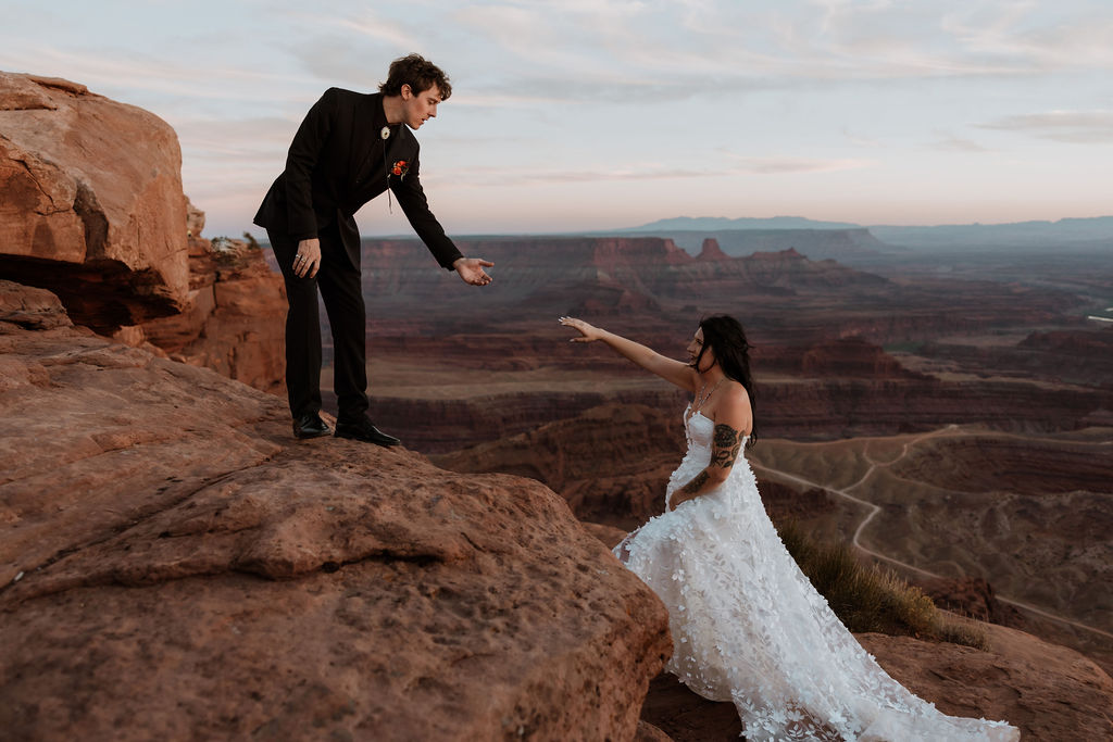 couple walks at Dead Horse Point State Park elopement