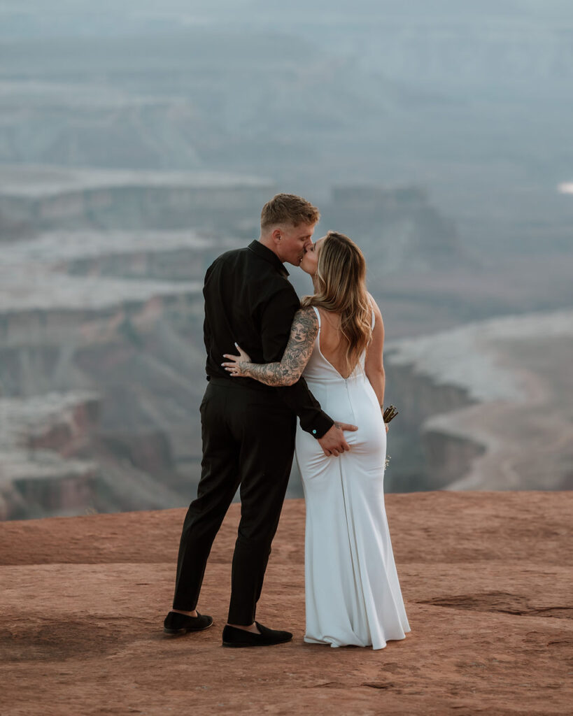 couple kisses at Canyonlands elopement