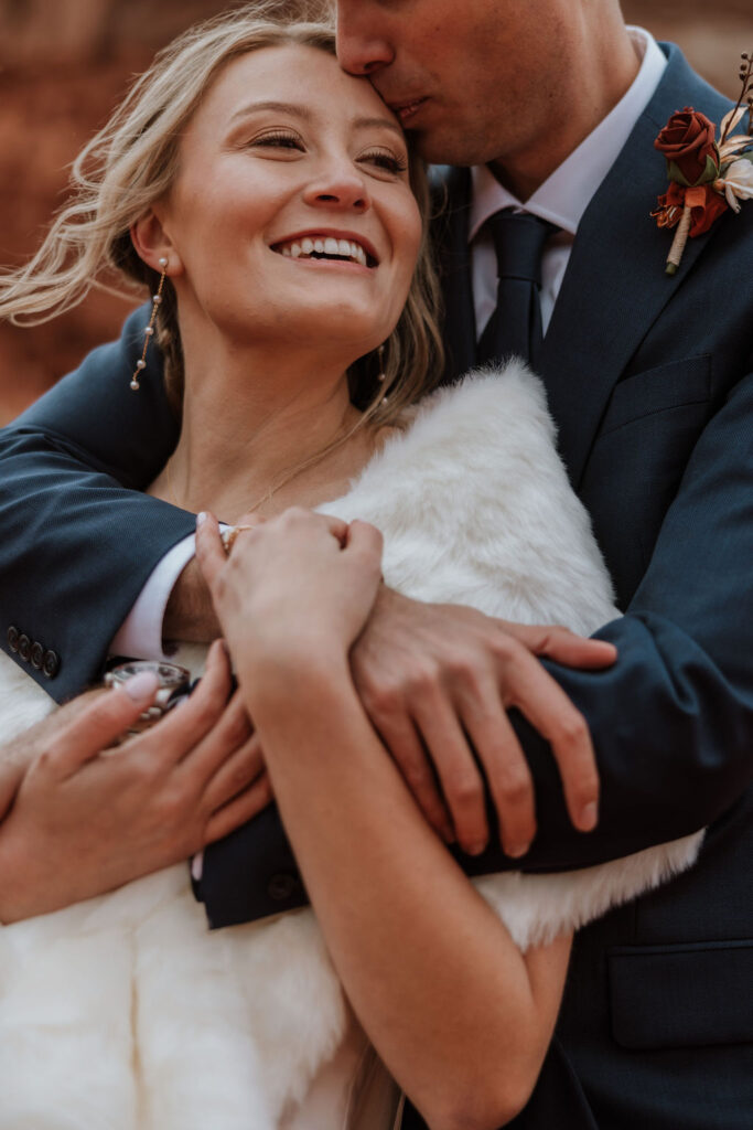 couple embraces at outdoor Moab elopement