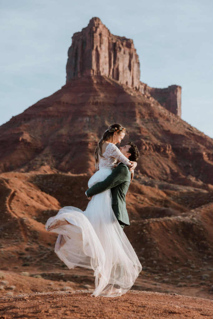 couple embraces at BLM land Moab Utah elopement