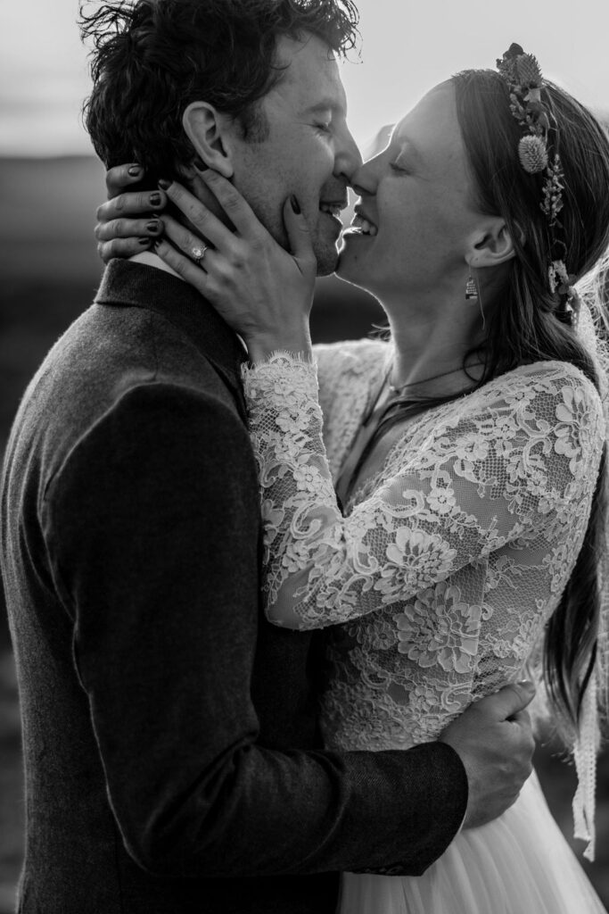 couple kisses during sunset Moab elopement