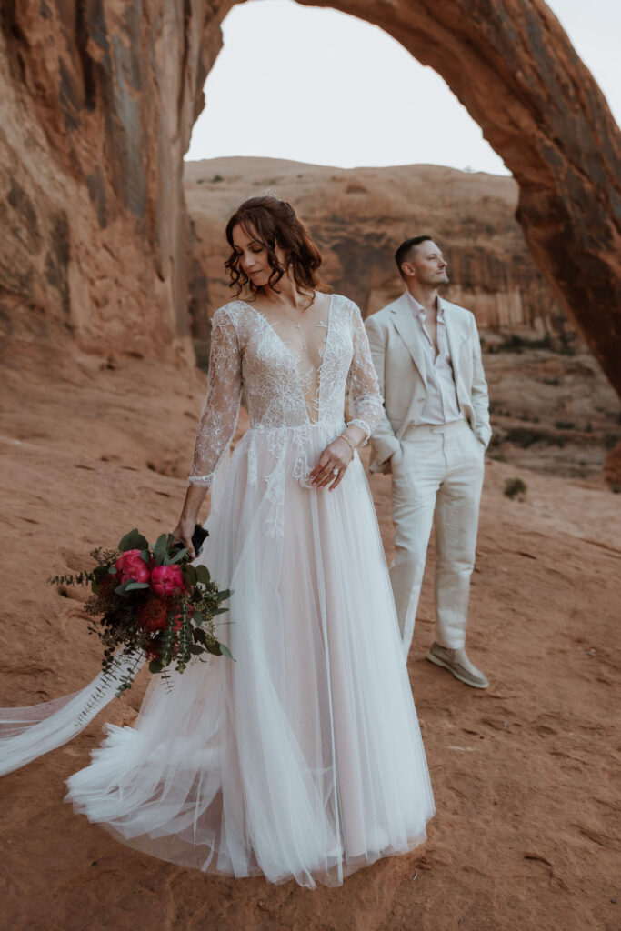 couple poses together at Moab elopement