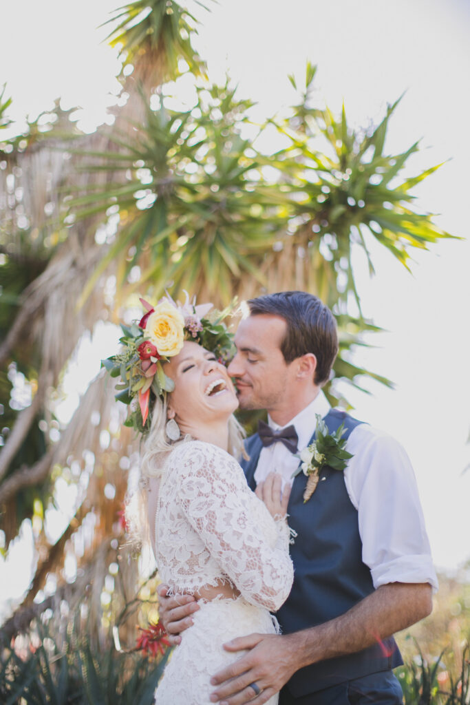 couple embraces at Hawaii wedding