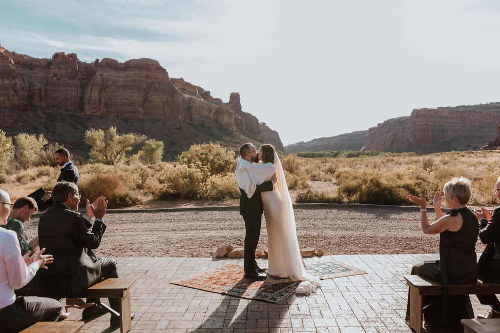 couple kisses at The Red Earth wedding ceremony