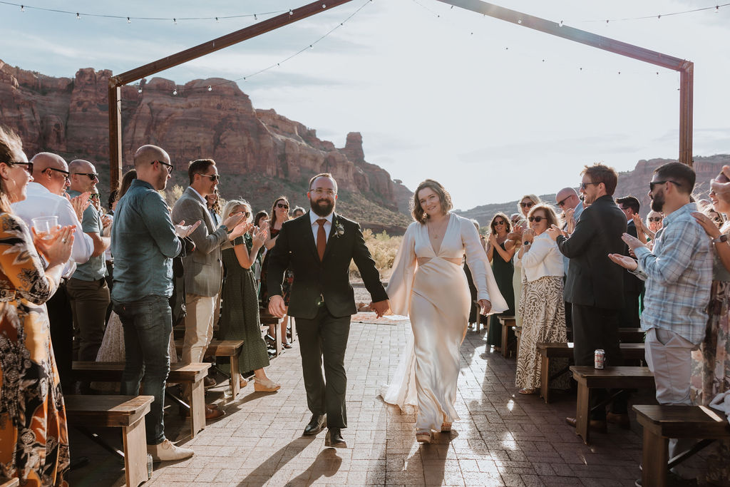 couple exits ceremony at The Red Earth Venue 