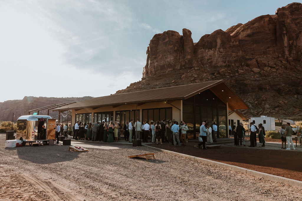 wedding guests mingle at The Red Earth Venue Moab