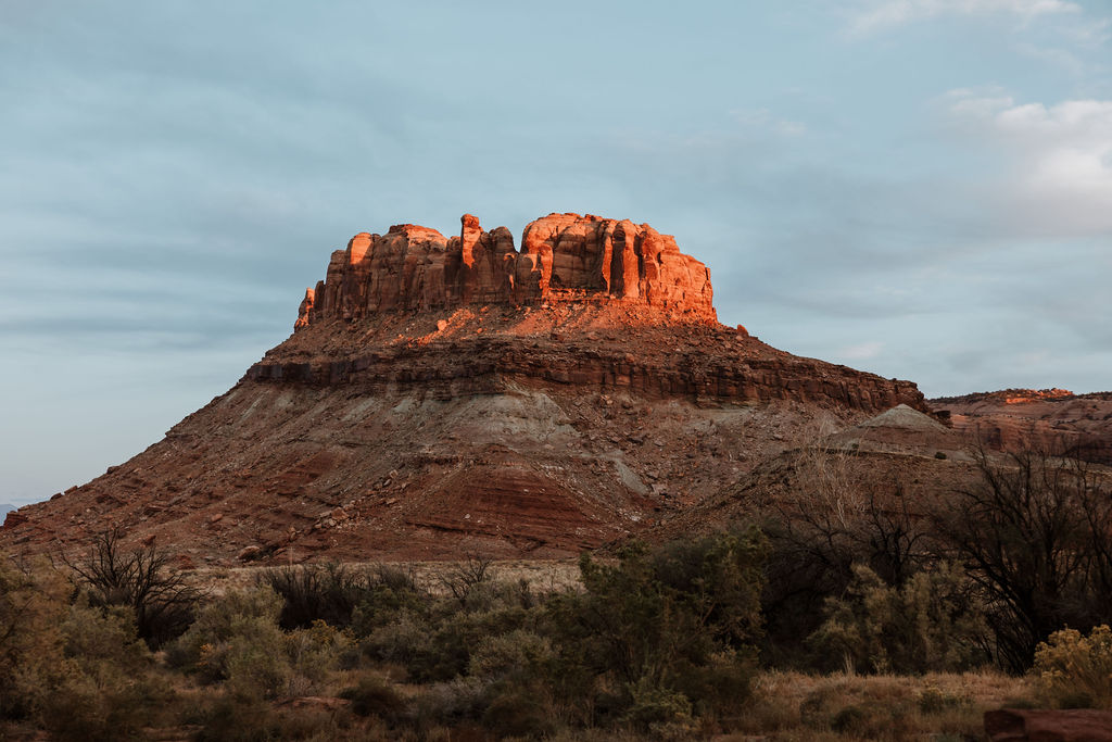 sunset over a sandstone butte captured by a Moab photographer