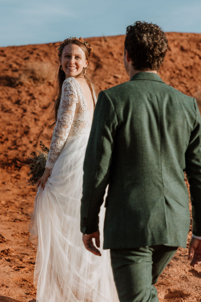 Bride glances back at her groom