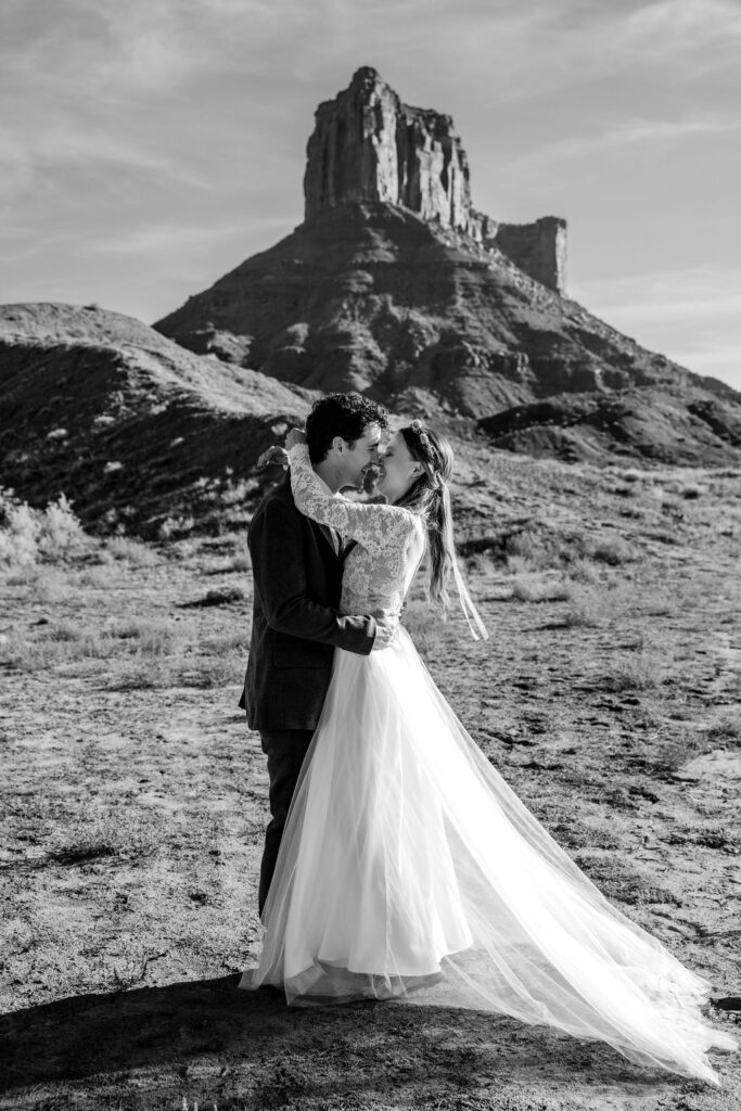 Couple embraces at Castle Valley Dessert elopement