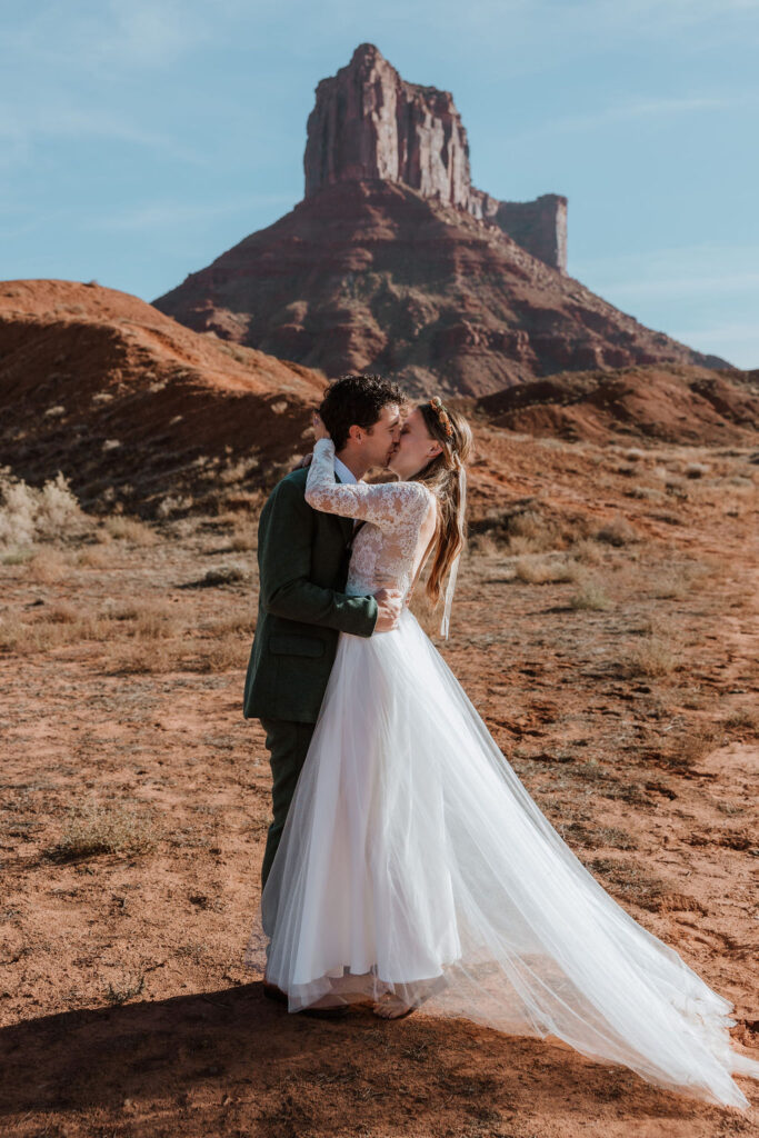 Couple kisses at Castle Valley Utah Elopement