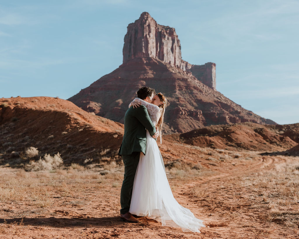 Couple kisses at Castle Valley Utah Elopement