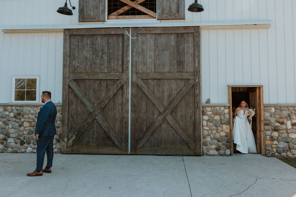 couple has first look at barn wedding venue