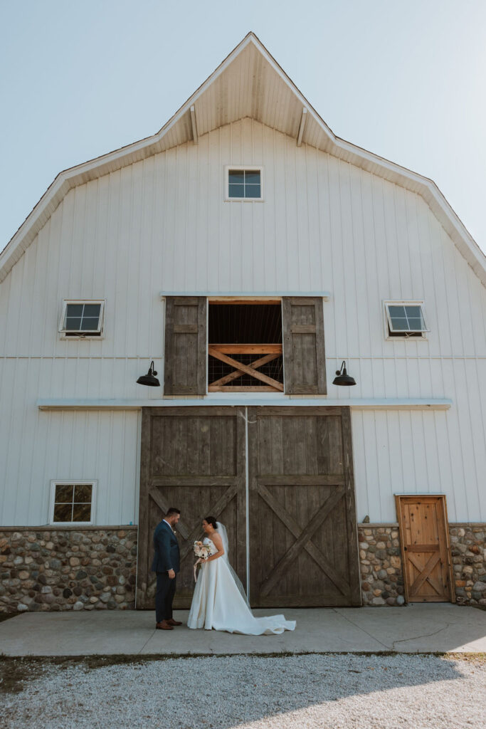 couple has first look at barn wedding venue