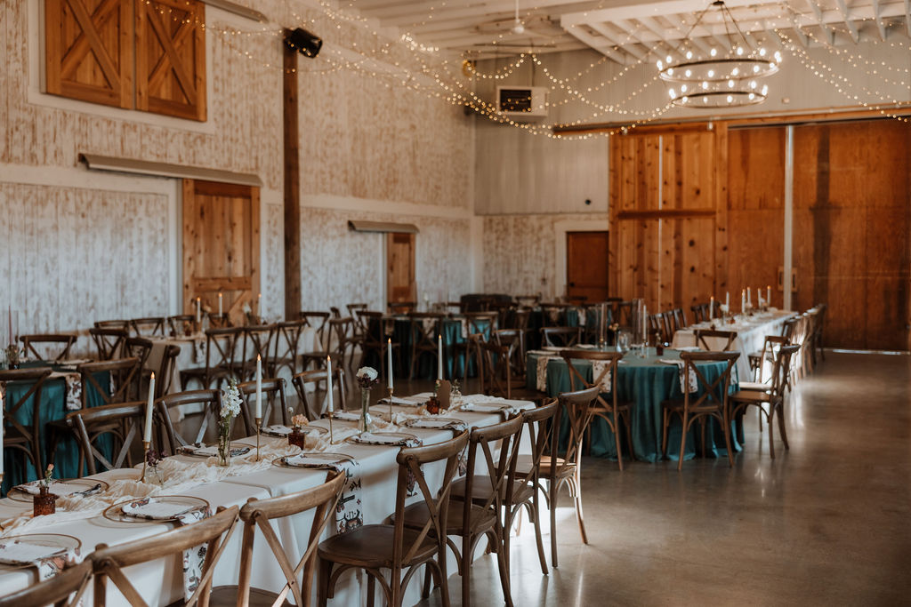 rustic wedding decor and table settings at barn wedding