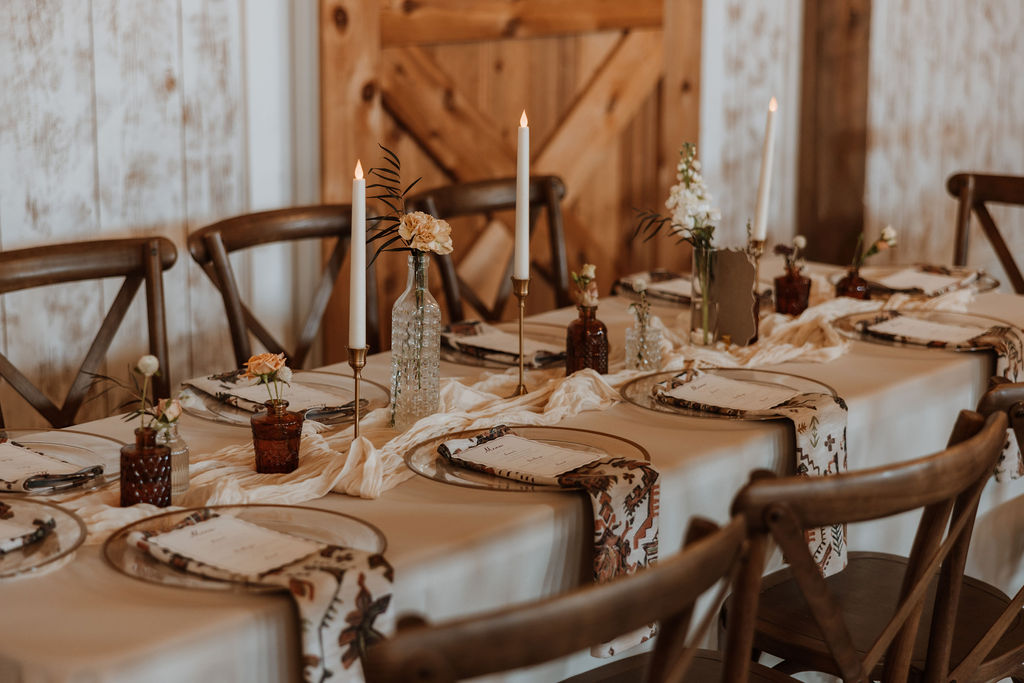rustic wedding decor and table settings at barn wedding